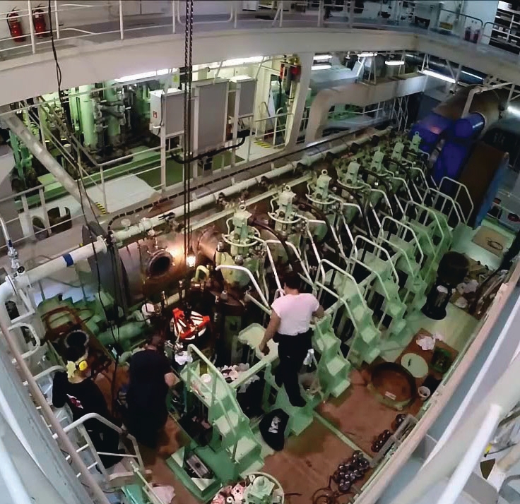 Engine room maintenance work on marine machinery