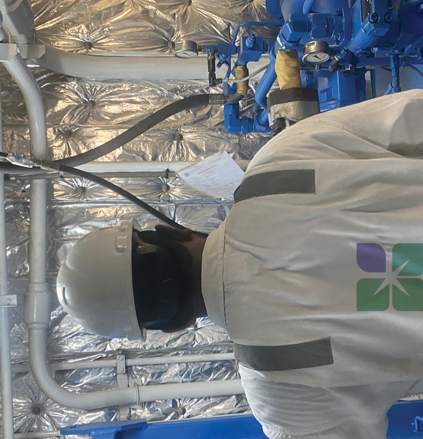 Technician working on marine engine systems